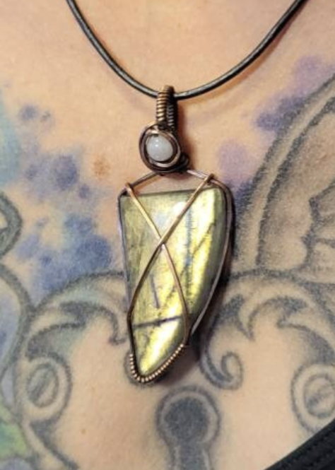 Labradorite gemstone pendant with green flash, accented with moonstone set in antiqued copper.