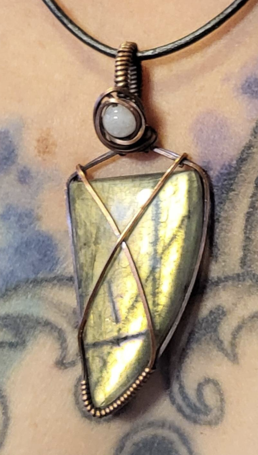 Labradorite gemstone pendant with green flash, accented with moonstone set in antiqued copper.