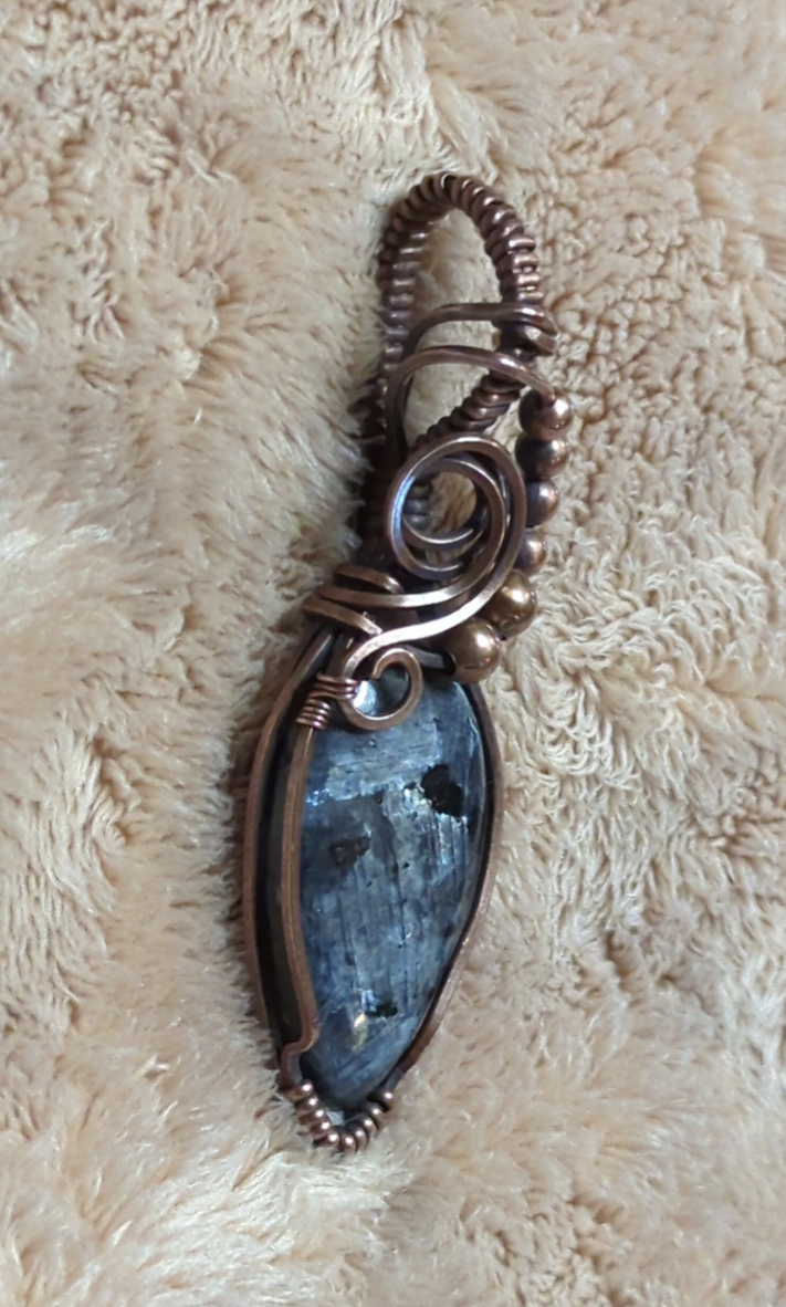 Larvakite gemstone pendant, also known as Black Moonstone, accented with copper beads, set in antiqued copper.