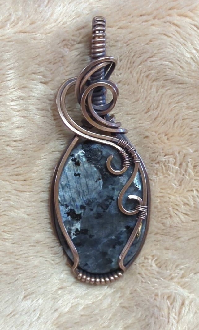 Larvakite gemstone pendant, also known as Black Moonstone, set in antiqued copper.