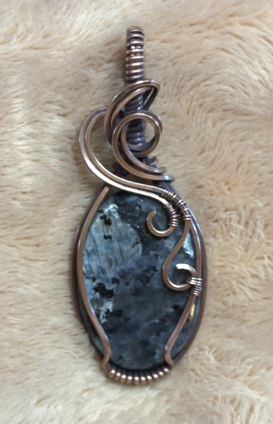 Larvakite gemstone pendant, also known as Black Moonstone, set in antiqued copper.