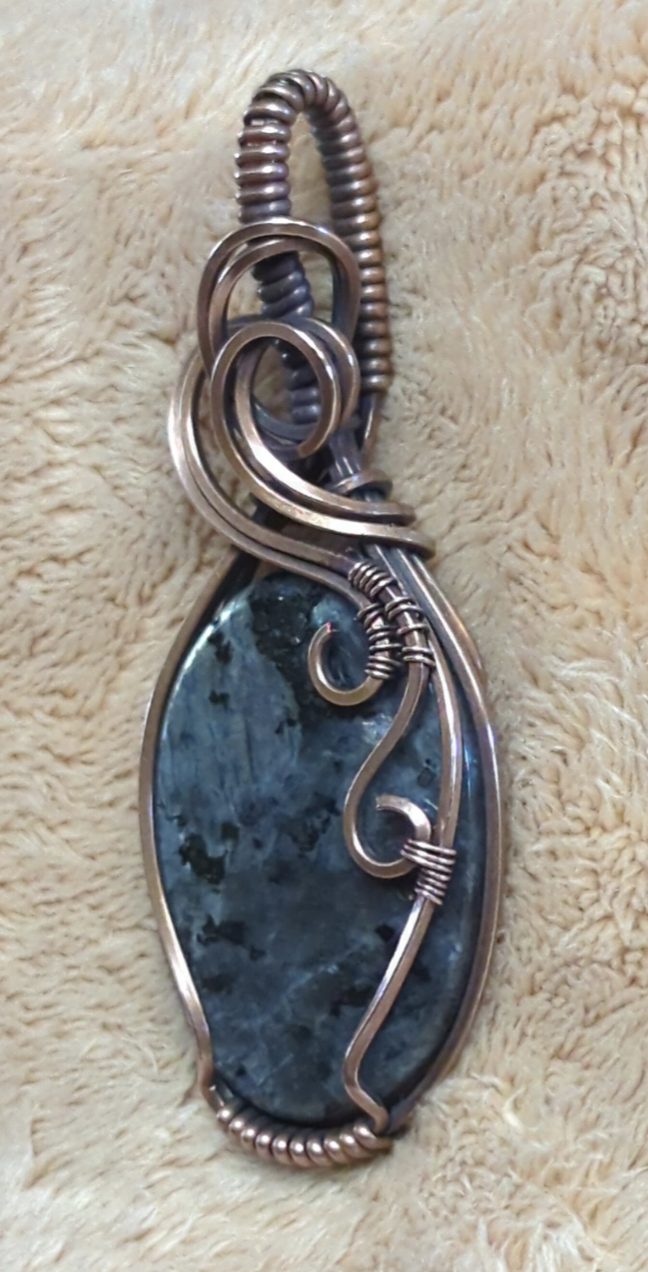 Larvakite gemstone pendant, also known as Black Moonstone, set in antiqued copper.