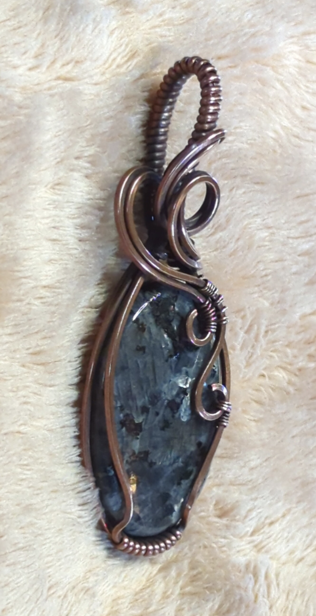 Larvakite gemstone pendant, also known as Black Moonstone, set in antiqued copper.