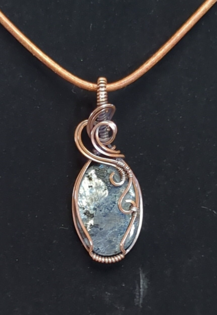 Larvakite gemstone pendant, also known as Black Moonstone, set in antiqued copper.