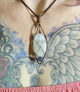 Moonstone gemstone pendant set in antiqued copper, accented with blue fluorite.