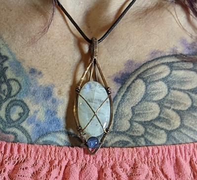 Moonstone gemstone pendant set in antiqued copper, accented with blue fluorite.