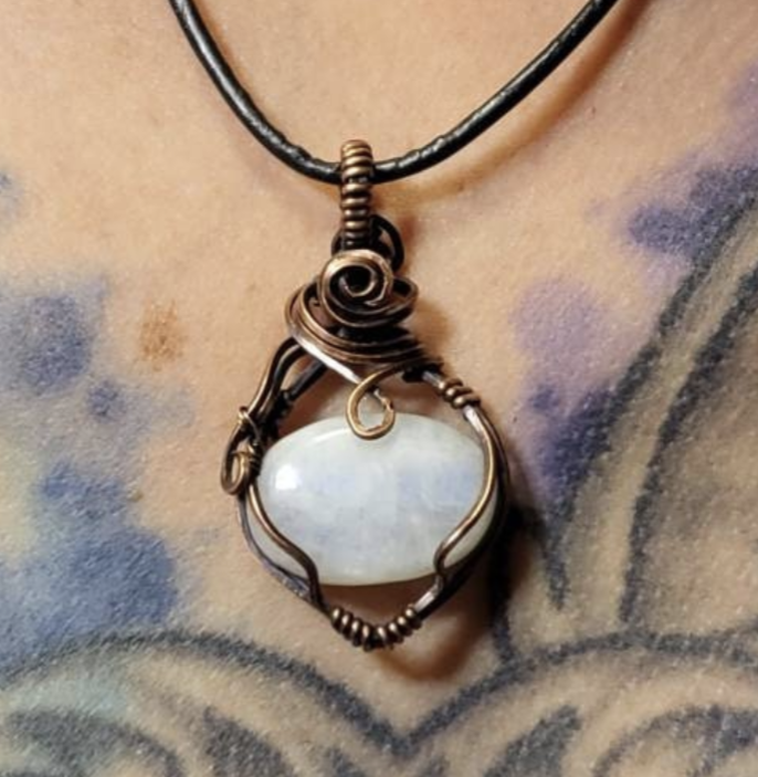 Moonstone  pendant, with a blue flash. Set in antiqued copper.