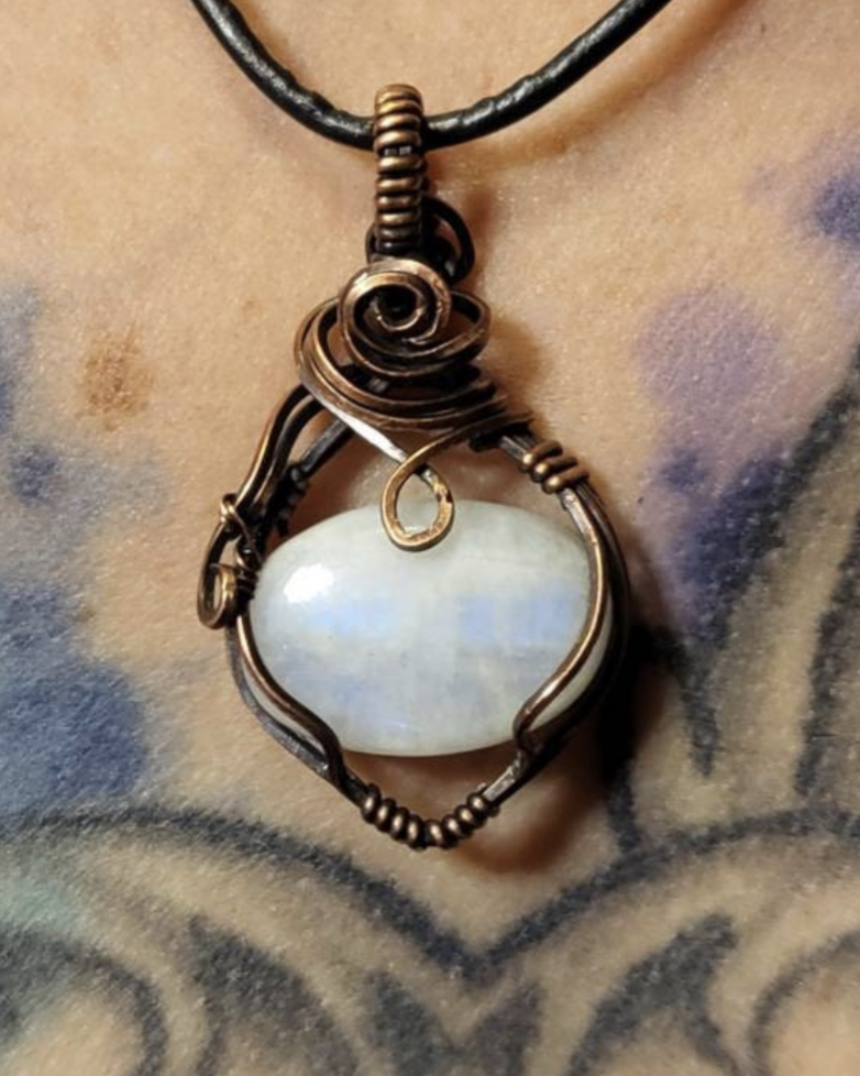 Moonstone  pendant, with a blue flash. Set in antiqued copper.