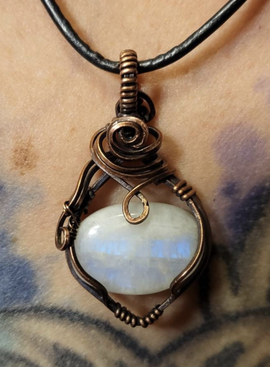 Moonstone  pendant, with a blue flash. Set in antiqued copper.