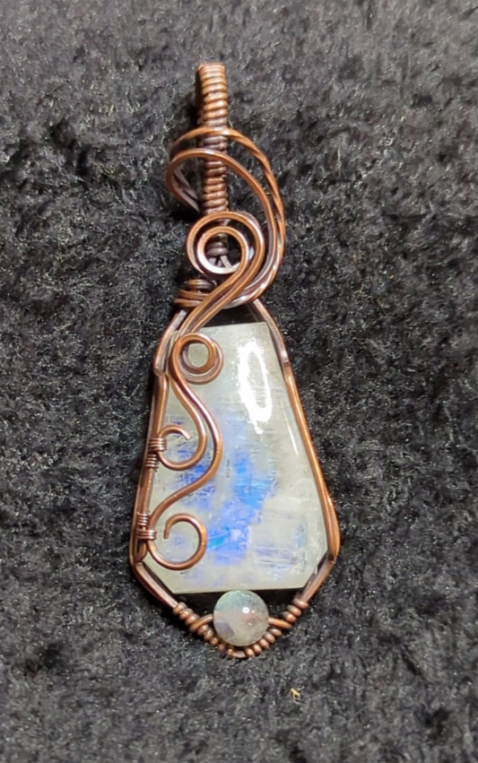 Moonstone pendant with blue flash, accented with Labradorite, set in antiqued copper.