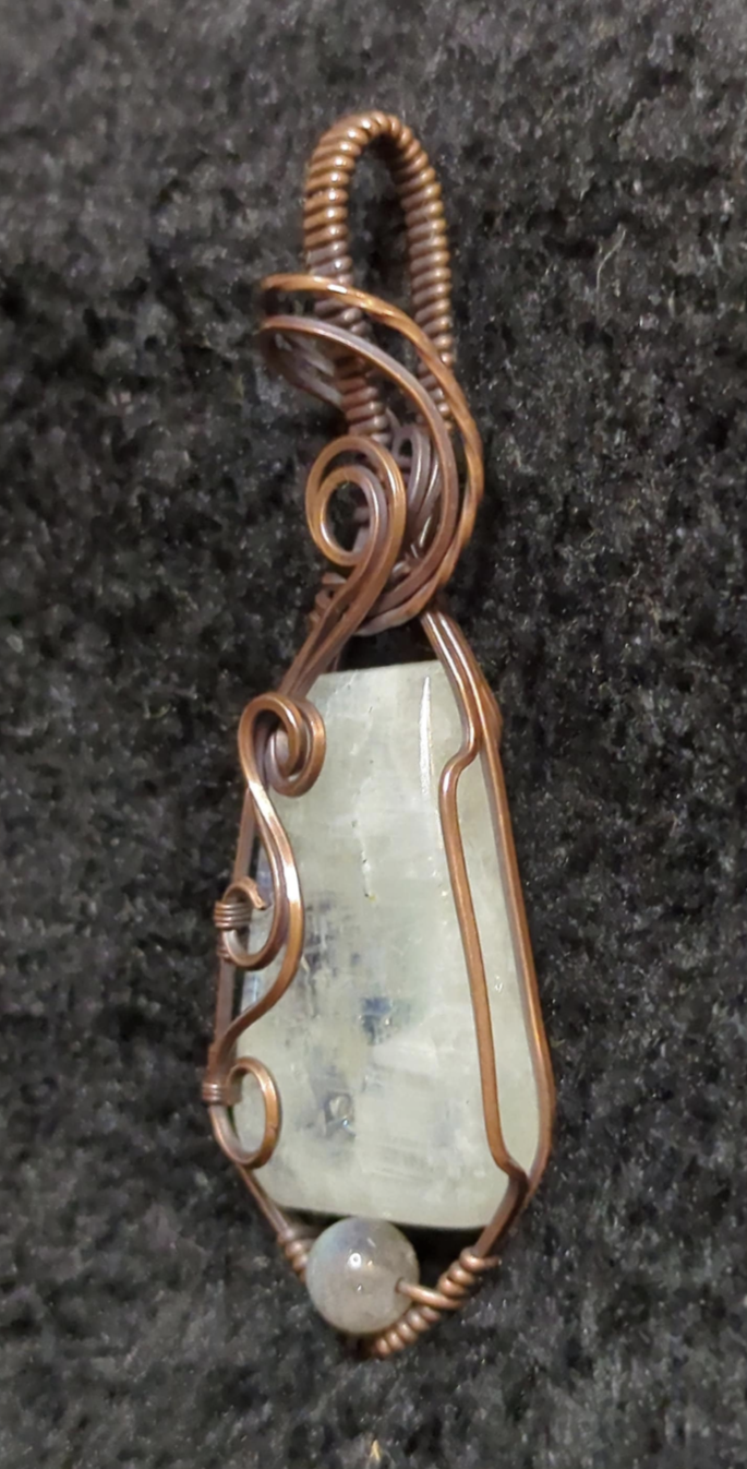 Moonstone pendant with blue flash, accented with Labradorite, set in antiqued copper.