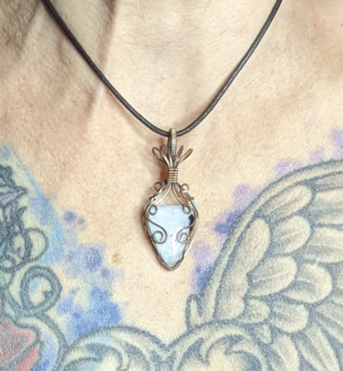 Moonstone pendant, with blue and green flash, set in antiqued copper.