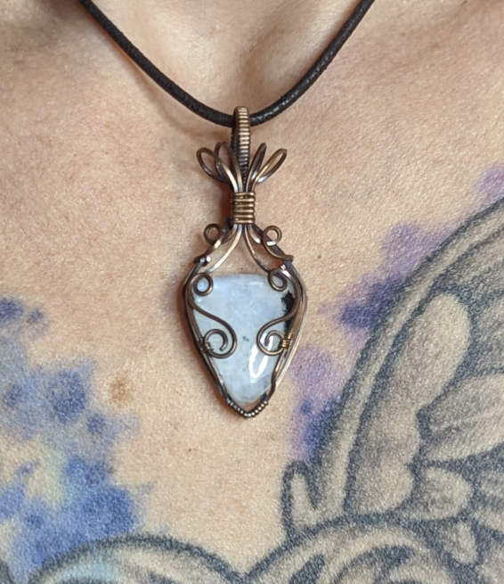 Moonstone pendant, with blue and green flash, set in antiqued copper.