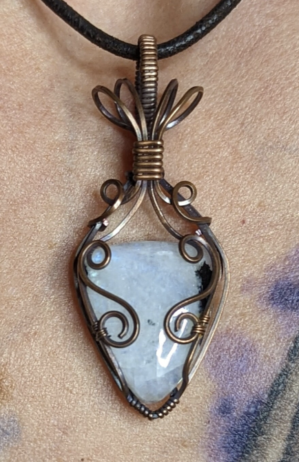 Moonstone pendant, with blue and green flash, set in antiqued copper.